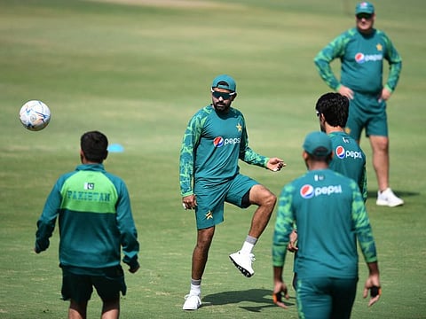 Pakistans captain Babar Azam (centre) plays football during a practice session on the eve of their ICC World Cup match against Netherlands at the Rajiv Gandhi International Stadium in Hyderabad on Thursday.