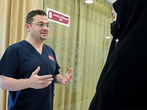 Dr. Wissam Al Sahli, Consultant, Interventional Cardiology, with F. Al Hosani, after her recovery at Burjeel Hospital in Abu Dhabi.