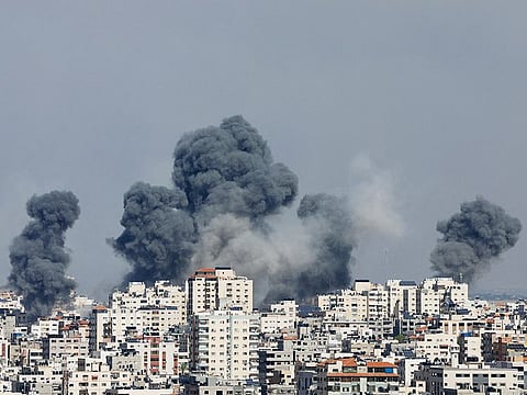 Smoke rises following Israeli strikes in Gaza, on October 7, 2023.