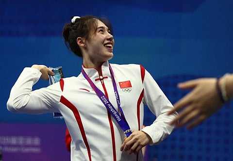 Gold medallist China's Zhang Yufei during the medal ceremony for the Women's 50m Butterfly at the Asian Games in Hangzhou on September 29.