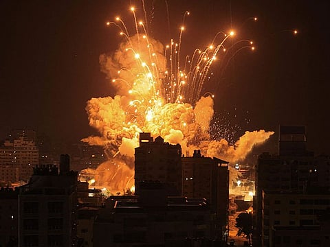 A missile explodes in a residential locality of Gaza City during an Israeli air strike
