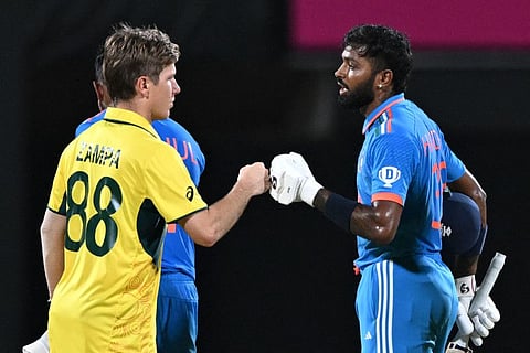 Australian spinner Adam Zampa congratulates Hardik Pandya (right) after India won the World Cup match in Chennai on Sunday.