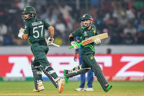 Pakistan's Mohammad Rizwan (right) and Abdullah Shafique take a run during the Cricket World Cup match against Sri Lanka at the Rajiv Gandhi International Stadium in Hyderabad on Tuesday.