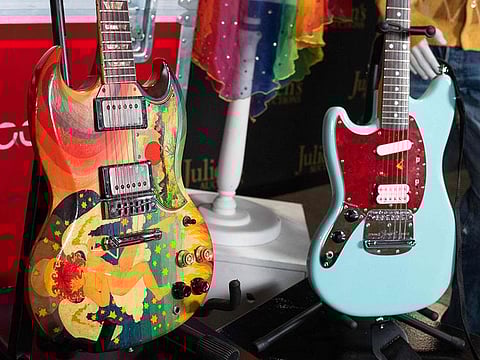 Eric Clapton’s Fool guitar (L) and Kurt Cobain’s Skystang I guitar are displayed at the media preview for Julien's “Played, worn, torn rock’n'roll iconic guitars and memorabilia" in Gardena, California.