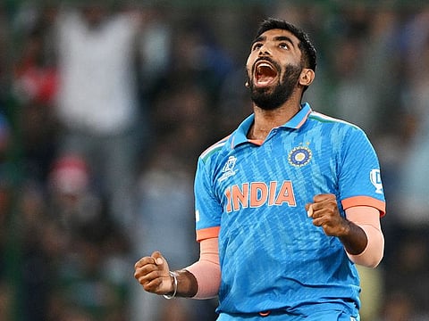 India's Jasprit Bumrah celebrates after taking the wicket of Afghanistan's Mohammad Nabi during the 2023 ICC Men's Cricket World Cup ODI match at the Arun Jaitley Stadium in New Delhi on October 11, 2023.