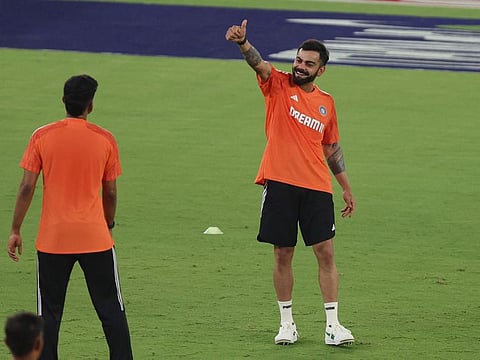India's Virat Kohli shows thumbs-up during practice. The start Indian batter has vowed to run extra 100-metre sprints during his preparation.