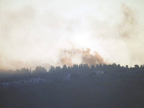 Smoke rises after Israeli shelling in the village of Odaisseh near the border with Israel in south Lebanon, Friday, Oct. 13, 2023.