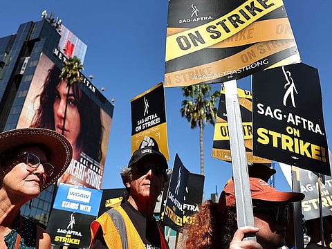 SAG-AFTRA members and supporters picket outside Netflix studios on day 91 of their strike against the Hollywood studios on October 12, 2023 in Los Angeles, California. Contract negotiations between SAG-AGTRA and the Alliance of Motion Picture and Television Producers (AMPTP) were suspended yesterday. The strike began July 14.