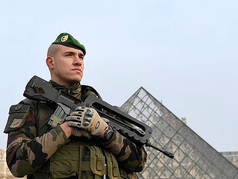 File photo: A soldier stands guard at the entrance of the Louvre's Pyramid, in Paris. The Louvre museum in Paris closed "for security reasons" on October 14, 2023 while France is on high alert following an attack in the northeastern town of Arras.