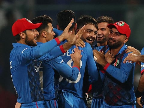 Afghanistan players celebrate after winning the match against England at the Arun Jaitley Stadium, New Delhi, on Sunday.