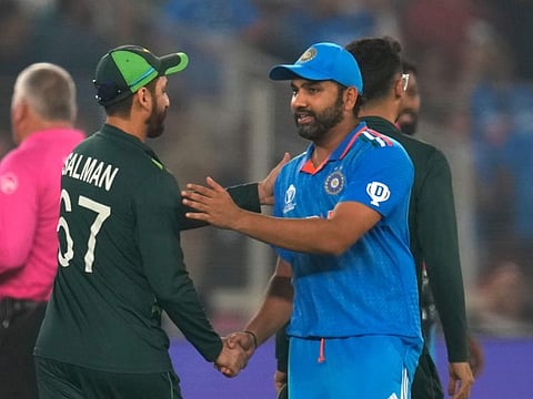 India's captain Rohit Sharma greets with Pakistan's Salman Agha following India's win in the World Cup match in Ahmedabad, India on Saturday.