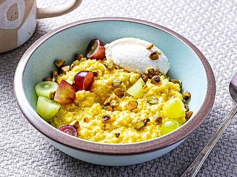 Warm breakfast millet with cardamom and toasted pistachios.