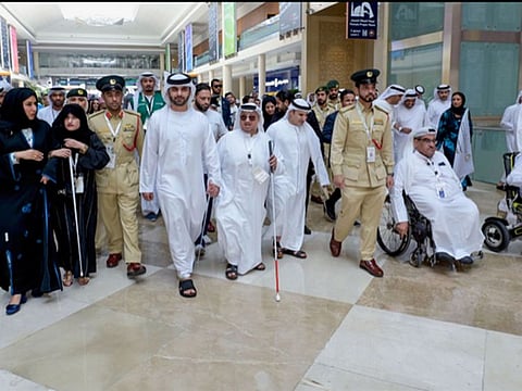 Sheikh Mansoor bin Mohammed bin Rashid Al Maktoum leading a march on White Cane Day in Dubai on Sunday.