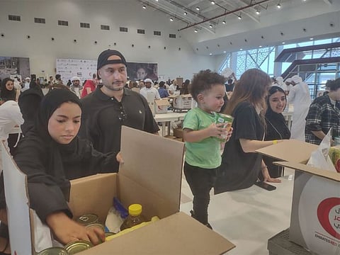Volunteers at the Tarahum - for Gaza relief campaign in Abu Dhabi on Sunday morning. Salem Abdul Rahman Al Gaabari was among the youngest participants who turned up at the campaign.