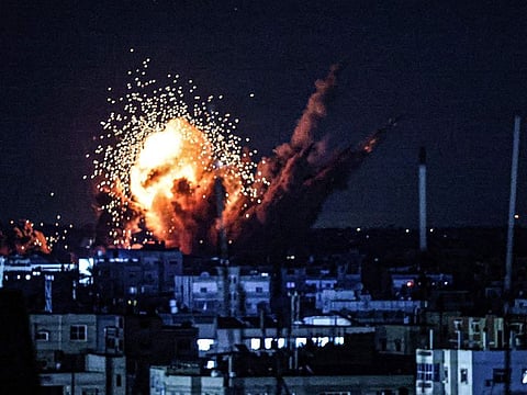 A ball of fire and smoke rise above buildings during an Israeli strike on Rafah in the southern Gaza Strip.