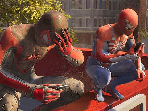 Balancing everyday New York life with Spider-Man responsibilities remains a challenge for Miles Morales, left, and Peter Parker in "Marvel's Spider-Man 2" for the PlayStation 5.