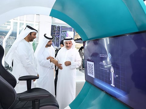 Sultan Butti Bin Mejren, Director General of the Dubai Land Department; Abdulqader Mousa, Chairman of the RDC; and Khalifa Al Zeraim Al Suwaidi; discuss the Dubai Land Department's RDC's new digital initiatives at Gitex Global 2023 on Tuesday.