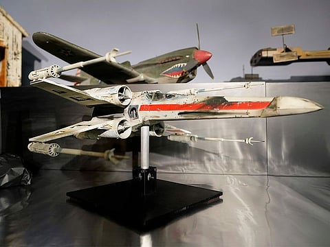 A miniature model called "Red Leader," a X-wing Starfighter from the 1977 film "Star War, Episode IV, A New Hope," sits on display at Heritage Auctions.