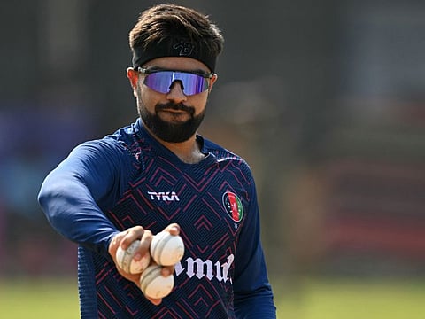 Afghanistan's Rashid Khan spins balls during a practice session on the eve of the World Cup match against New Zealand in Chennai on Tuesday.
