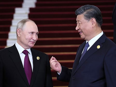 Russian President Vladimir Putin, left, and Chinese President Xi Jinping talk during their meeting on the sidelines of the Belt and Road Forum in Beijing, China, on Tuesday, Oct. 17, 2023.