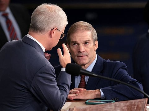 U.S. Rep. Jim Jordan (R-OH) (R) talks to Speaker Pro Tempore Rep. Patrick McHenry (R-NC) as the House of Representatives prepares to hold a vote on a new Speaker of the House at the U.S. Capitol on October 18, 2023 in Washington, DC.