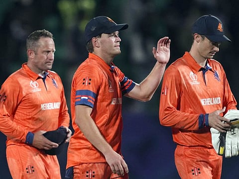 Netherlands skipper Scott Edwards and teammates celebrate their win over South Africa in Dharamsala on Tuesday.