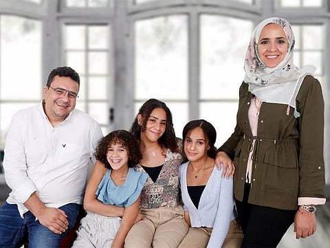 Samar Amer with her husband and three daughters: Finding joy in small moments.