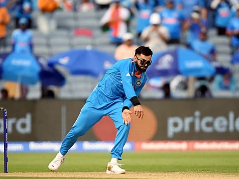 India's Virat Kohli bowls during the World Cup match against Bangladesh at Maharashtra Cricket Association Stadium, in Pune on Thursday.