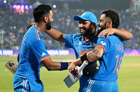 India's Virat Kohli celebrates with KL Rahul and skipper Rohit Sharma after winning their match against Bangladesh in the Cricket World Cup at Maharashtra Cricket Association Stadium, in Pune on Thursday.