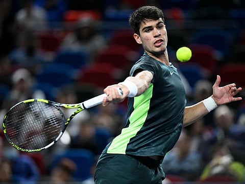 Spains Carlos Alcaraz in action against Bulgarias Grigor Dimitrov during their men's singles match at the Shanghai Masters.