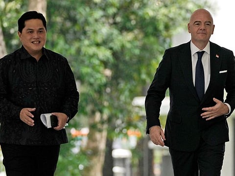 Fifa President Gianni Infantino (right) with Erick Thohir upon arrival for a meeting at Merdeka Palace in Jakarta, Indonesia, on October 18.