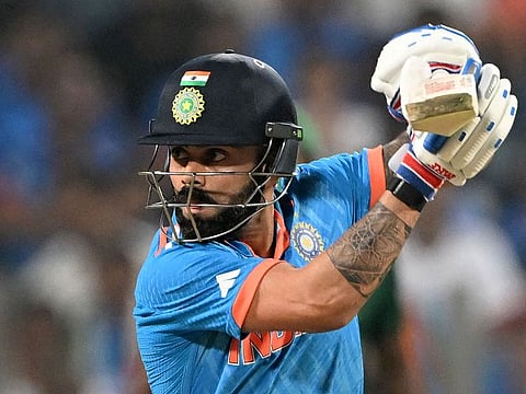 India’s Virat Kohli plays a shot against Bangladesh in the ICC Cricket World Cup 2023 match at the Maharashtra Cricket Association Stadium in Pune on October 19, 2023. His unbeaten 103 off 97 balls steered India to a seven-wicket victory.