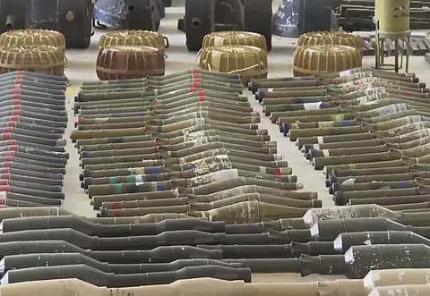 Suspected North Korean-made F-7 rocket-propelled grenades, many with a distinctive red stripe on their warhead, are seen at an Israeli military base in southern Israel, on October 15, 2023.