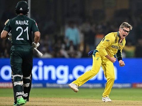 Australia’s Adam Zampa celebrates after taking the wicket of Pakistan’s Mohammad Nawaz during the 2023 ICC Men's Cricket World Cup one-day international (ODI) match at the M. Chinnaswamy Stadium in Bengaluru, India, on October 20, 2023.