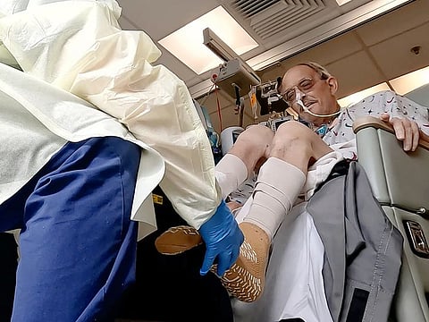 In this image from video provided by the University of Maryland School of Medicine, Lawrence Faucette, a pig heart transplant patient, works with a physical therapist at the school's hospital in Baltimore, Maryland.