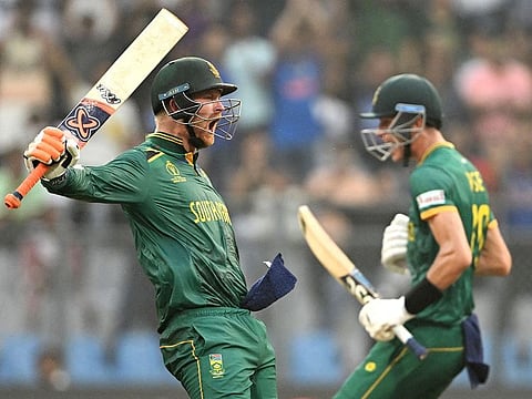 South Africa's Heinrich Klaasen (L) celebrates after scoring a century next to Marco Jansen during the 2023 ICC Men's Cricket World Cup ODI against England at the Wankhede Stadium in Mumbai on October 21, 2023.