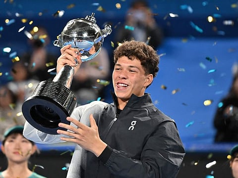 USA's Ben Shelton lifts his trophy during the awards ceremony of the ATP Japan Open in Tokyo on Sunday.