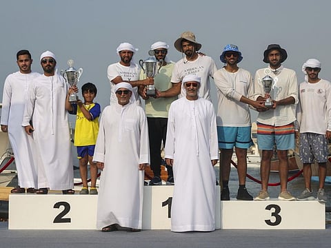 Winners on the podium with officials at the Dubai International Marine Club