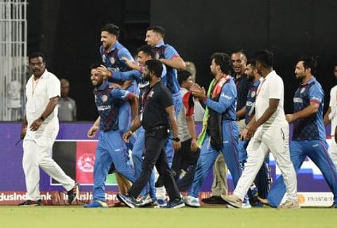 Afghanistan players celebrate after winning the match by 8 wickets against Pakistan at the MA Chidambaram Stadium, Chennai, on Monday.