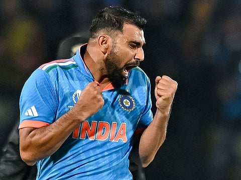 India’s Mohammed Shami celebrates after taking the wicket of New Zealand’s Matt Henry during the 2023 ICC Men's Cricket World Cup match at the Himachal Pradesh Cricket Association Stadium in Dharamsala on October 22, 2023. Shami returned a haul of wickets as India won by five wickets to maintain their unbeaten streak in the tournament.