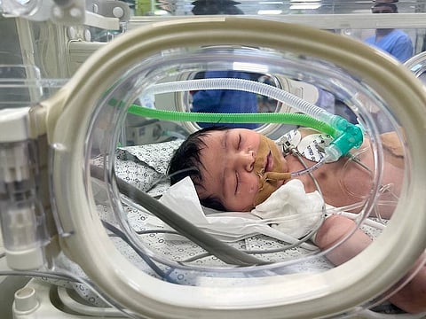 A name tag on the incubator reads: “Baby of the martyr Dareen Abu Shamalah” with the date of birth October 21 - the same date on which his other two children were born.