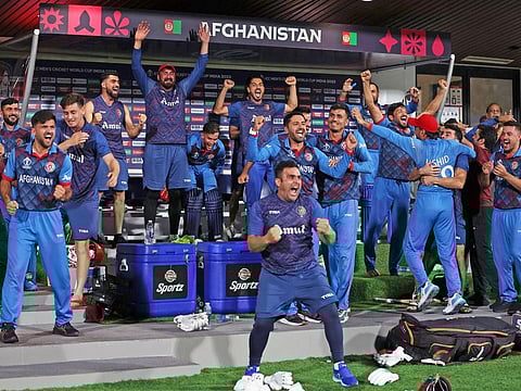 Afghanistan players celebrate their team’s victory against Pakistan in the World Cup 2023 at in Chennai.
