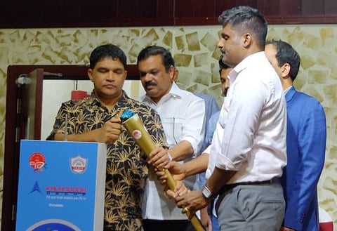 The torch for the Technolympics being lit during a press conference to announce the details of the tournament in Dubai.