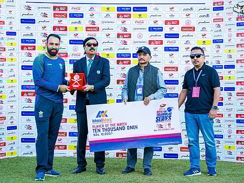 Hong Kong's Babar Hayat receives the Player of the Match award.