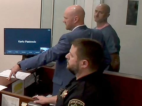 Joseph David Emerson, 44, an Alaska Airlines pilot who was riding in the cockpit "jump seat" and is accused of trying to disable the engines Horizon Air jet, appears in Multnomah County court in Portland, Oregon, U.S. October 24, 2023 in a still image from video.