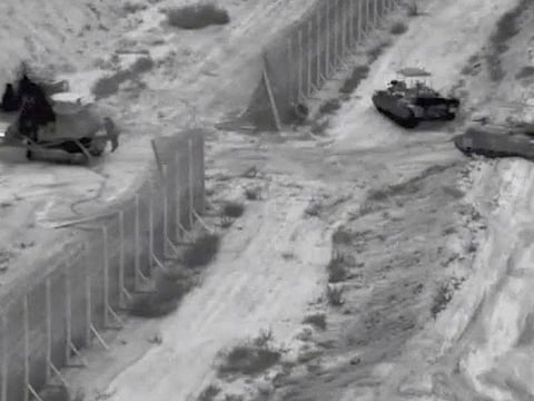 Israeli armoured vehicles take part in an operation, as the conflict between Israel and Hamas continues, at a location given as the northern Gaza Strip.