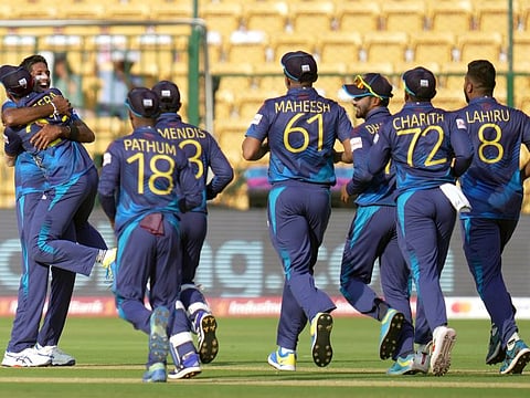 Sri Lanka's Kasun Rajitha celebrates the wicket of England's Chris Woakes during their match at M.Chinnaswamy Stadium in Bengaluru on Thursday.