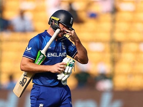 England’s Jos Buttler walks after being caught behind off the bowling of Sri Lanka’s Lahiru Kumara during the 2023 ICC Men's Cricket World Cup match at the M. Chinnaswamy Stadium in Bengaluru, India, on October 26, 2023.