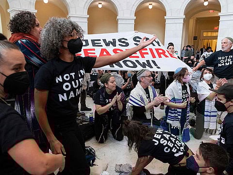 Members of the US Jewish community protest against the Israeli military operation in Gaza inside the Cannon building in the US Capitol in Washington, DC on October 18, 2023