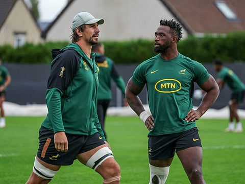 South Africa's lock Eben Etzebeth (left) and flanker Siya Kolisi attend a training session in Domont, North of Paris.